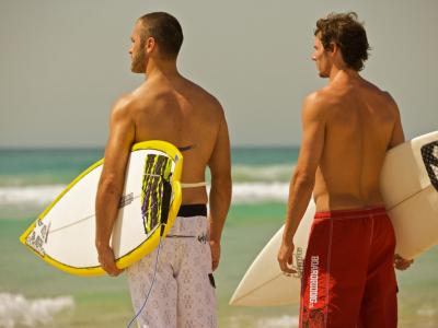 Surfers on the Gold Coast.  Photo credit: Tourism Australia copyright.